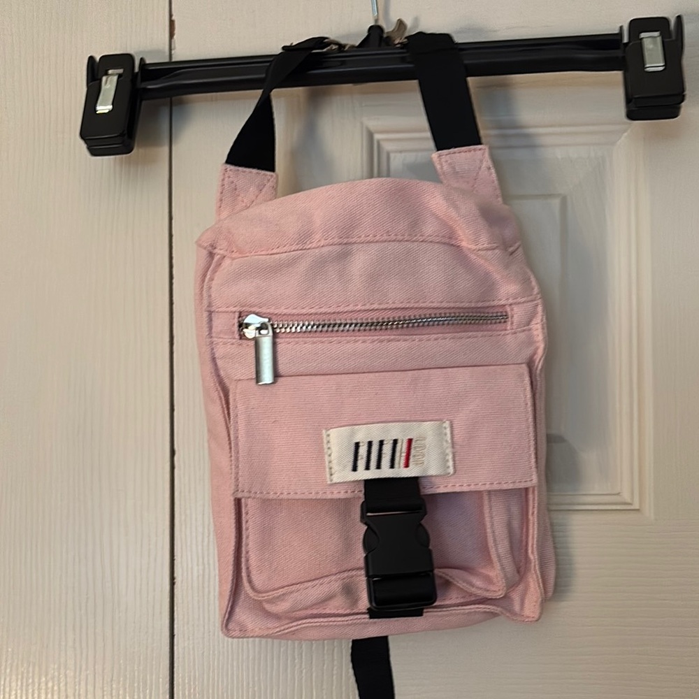 Pink Belt Bag with Black Accents and Structured Design